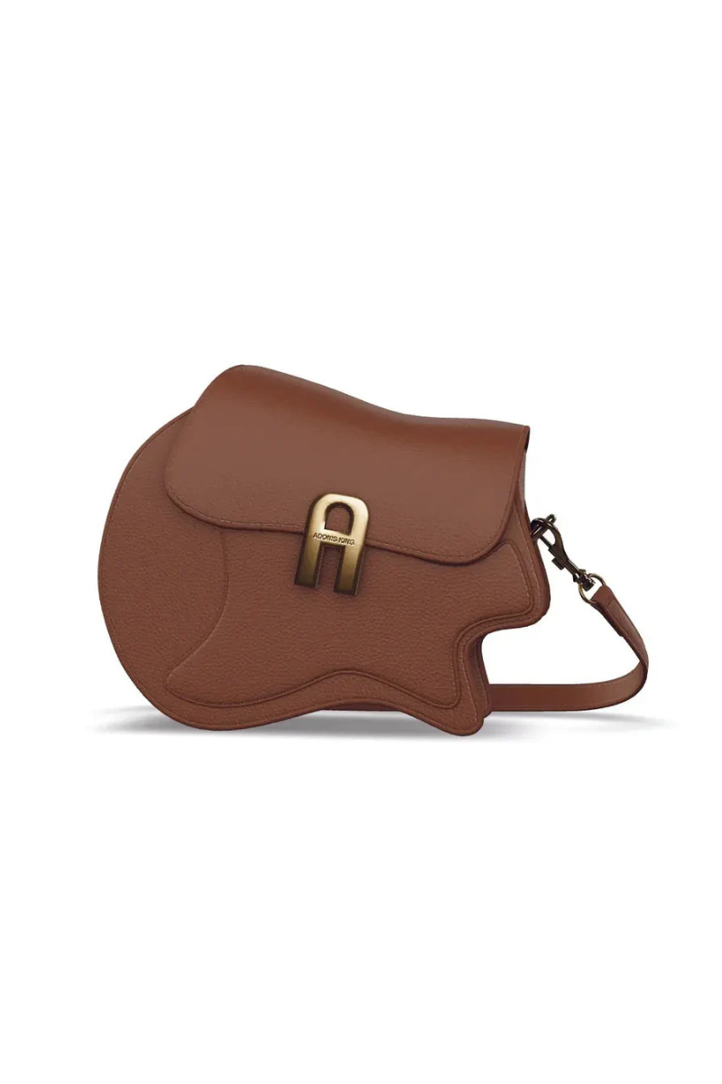 Brown leather saddle bag with gold buckle on a white background