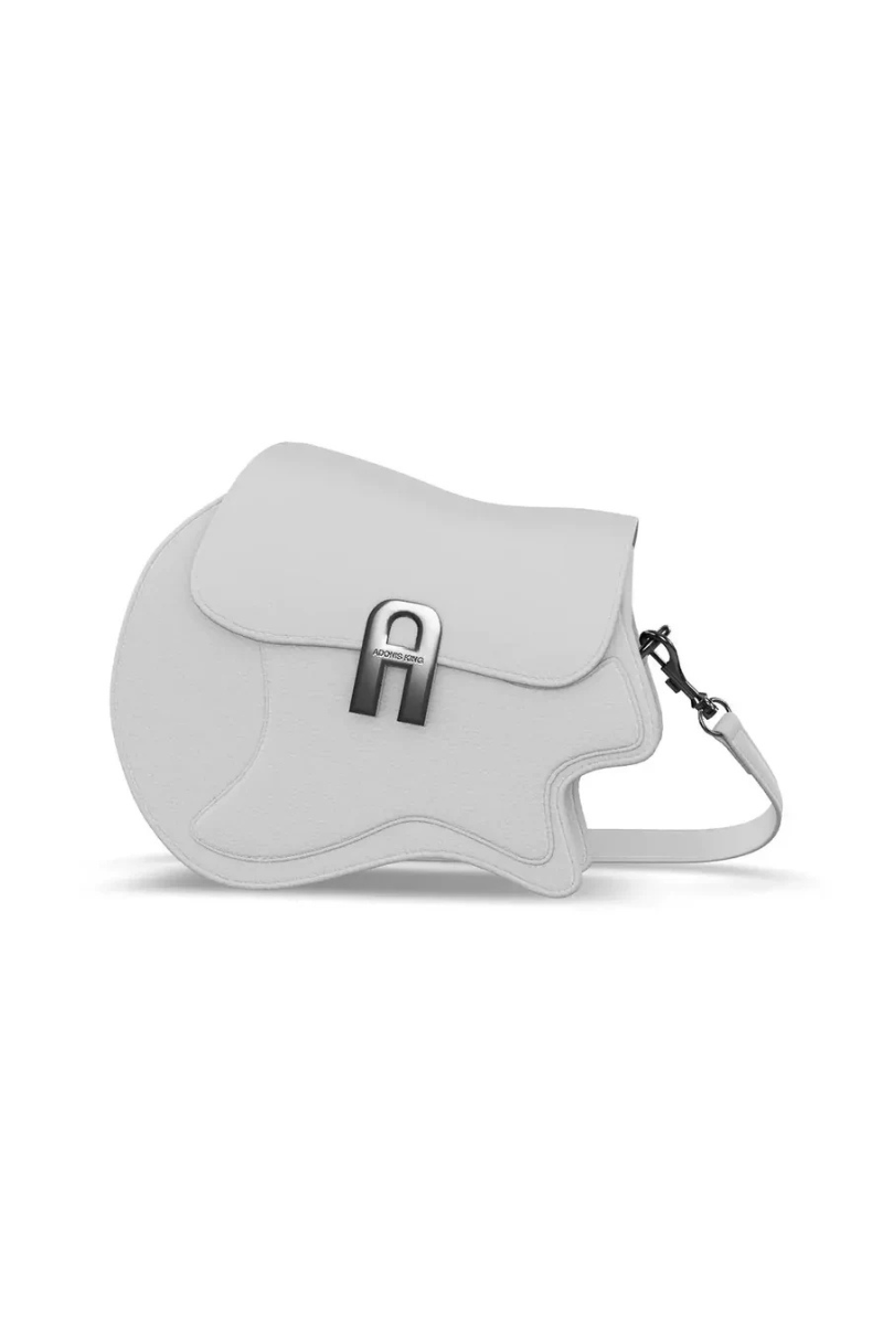 White saddle bag with a silver buckle on a white background
