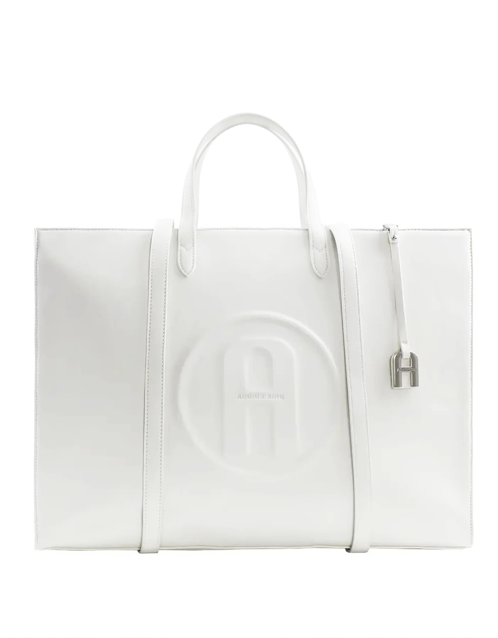 A white leather tote bag with a large embossed circular logo on the front, dual top handles, a side zipper, and a small silver padlock detail, shown against a plain white background.